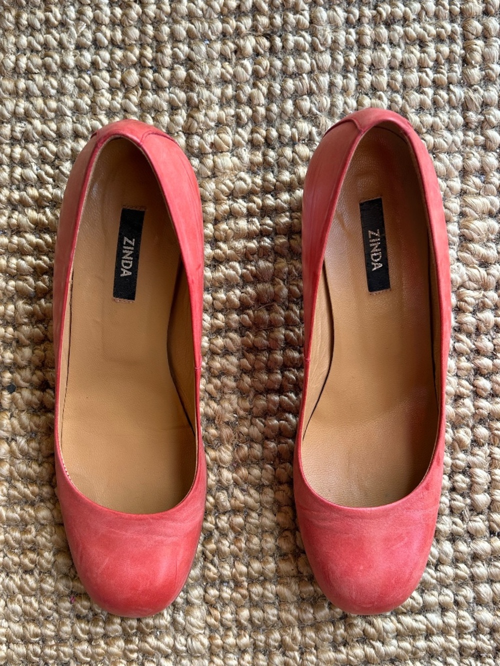 Coral leather court shoes with woven heel detail